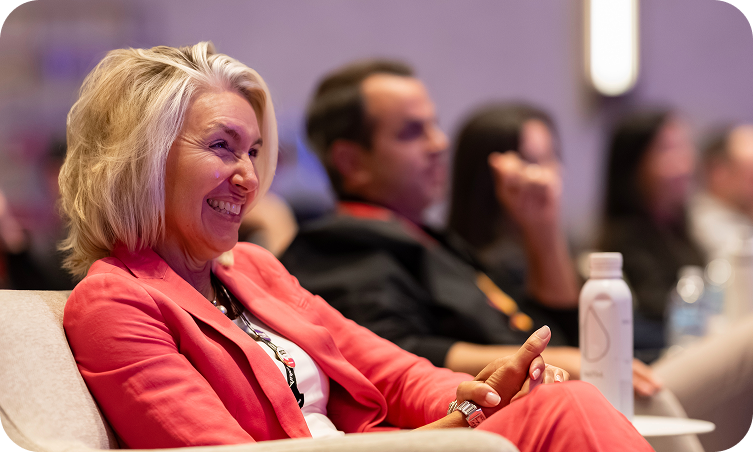 Closeup of a smiling attendee at Splunk Go.