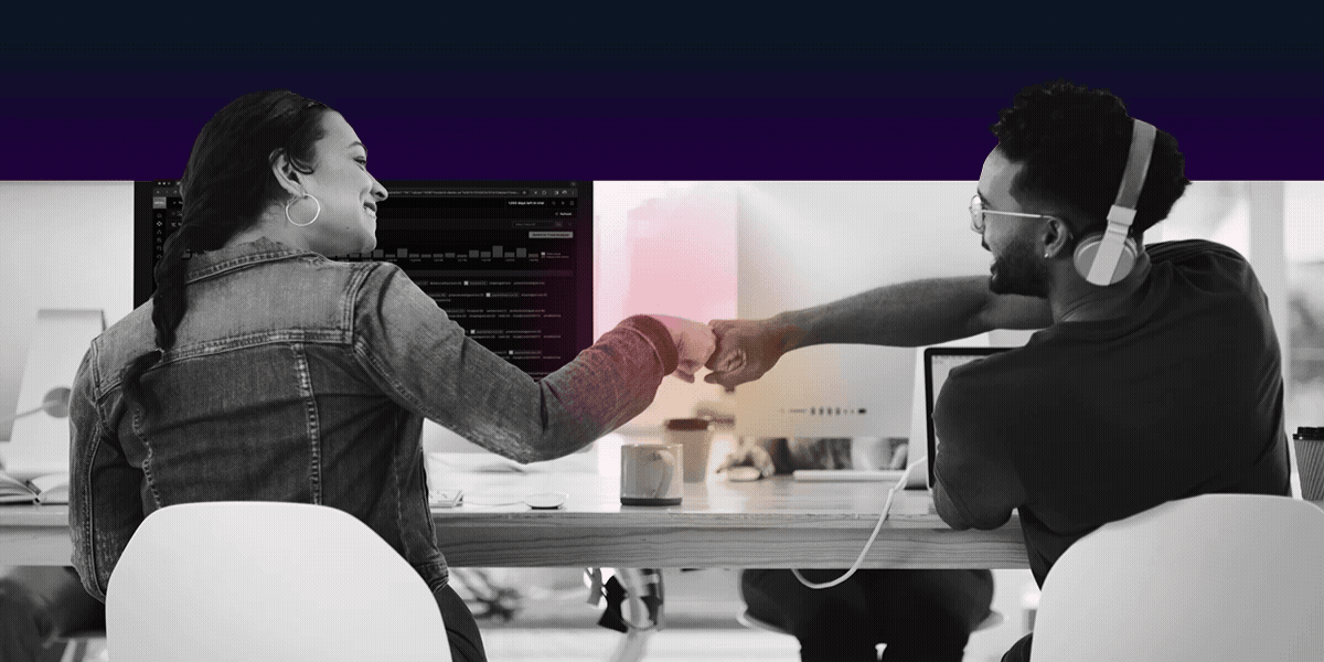 Two ITOps professionals congratulate each other on a business achievement.